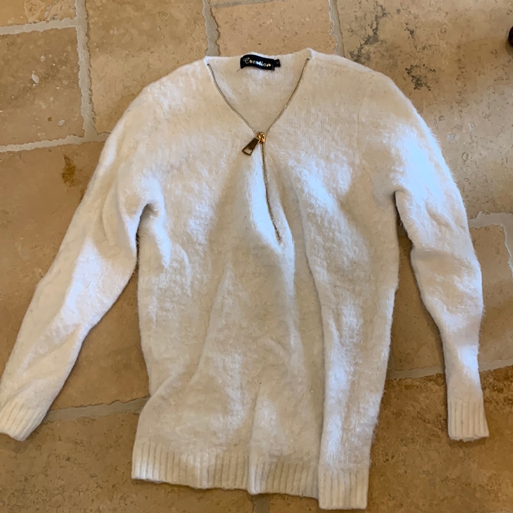 A cute white sweater in the brand creation
